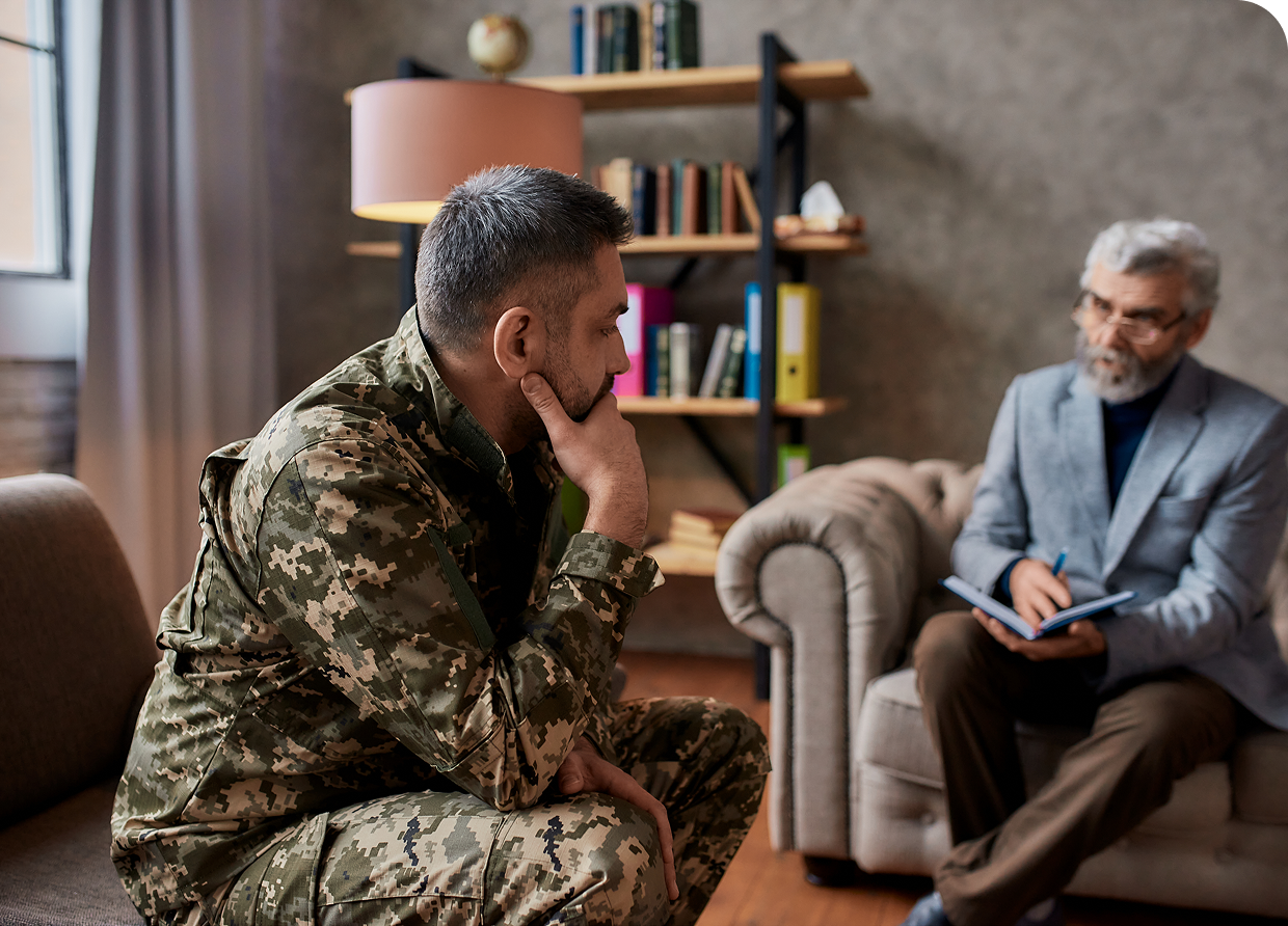 Soldier in therapy session with counselor.