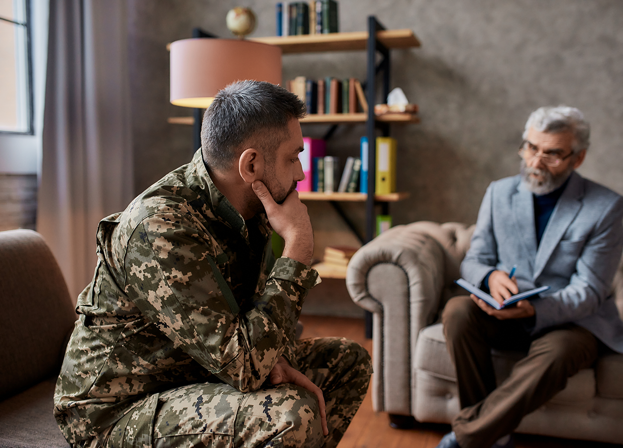 Soldier in therapy session with counselor.